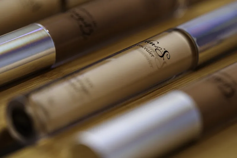 Row of lipstick tubes in warm side light